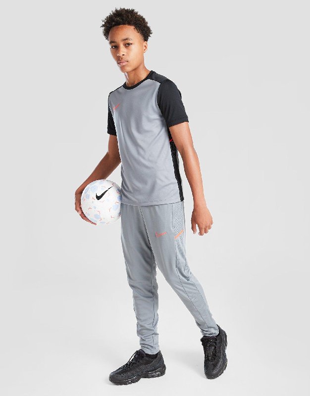 Nike Academy Older Kids' Dri-FIT Football Pants - Cool Grey/Bright Crimson - Size XS